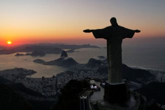 Christ the Redeemer is photographed at sunrise in Rio de Janeiro on May 17.