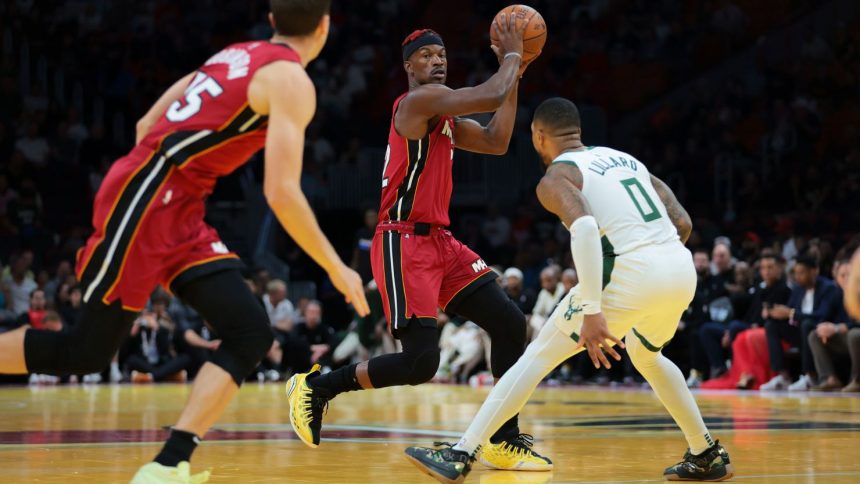 Miami forward Jimmy Butler (middle) will not be traded, according to Heat president Pat Riley.