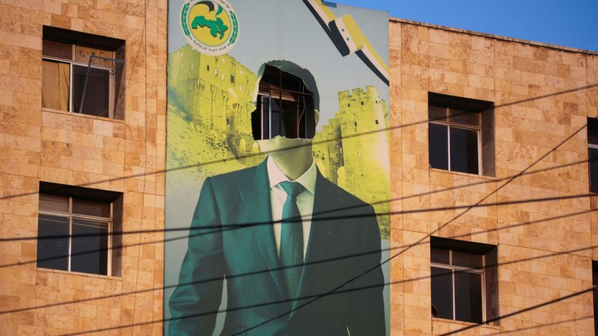 A damaged poster of Syrian President Bashar al-Assad in Aleppo.