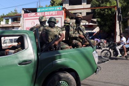 Members of the Haitian Armed Forces patrol as people flee homes following the gang violence over the weekend in Port-au-Prince.