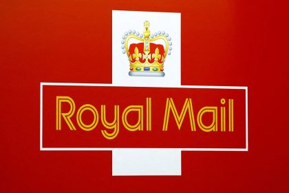 A Royal Mail sign on a delivery truck.