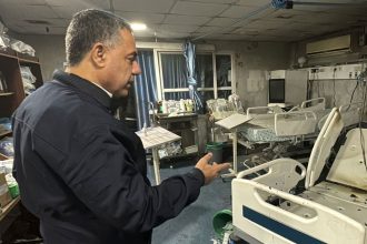 Hussam Abu Safiya, director of Kamal Adwan hospital, shows the damage inside the hospital in Beit Lahiya, in the northern Gaza Strip, on December 18.