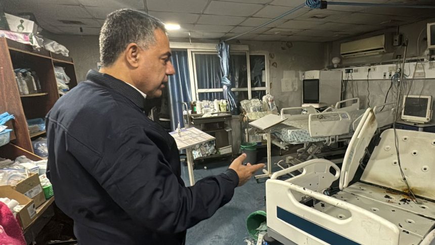 Hussam Abu Safiya, director of Kamal Adwan hospital, shows the damage inside the hospital in Beit Lahiya, in the northern Gaza Strip, on December 18.