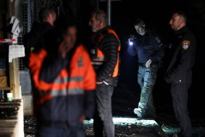 Israeli police bomb squad members work near a damaged site after a projectile fired from Yemen was intercepted, in Ramat Gan, Israel December 19, 2024.