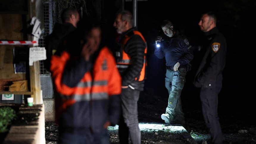 Israeli police bomb squad members work near a damaged site after a projectile fired from Yemen was intercepted, in Ramat Gan, Israel December 19, 2024.