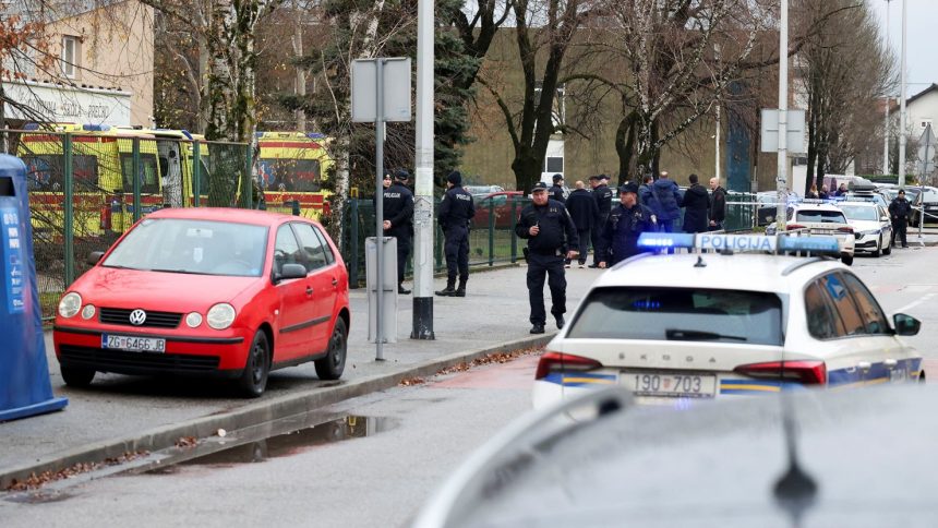 Police officers respond to a knife attack at a primary school in Zagreb, Croatia, on Friday.