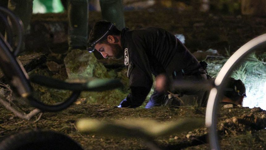 Israeli emergency services work at the scene of a missile strike that, according to Israel’s military, was launched from Yemen and landed in Jaffa, south of Tel Aviv, Israel, December 21, 2024.