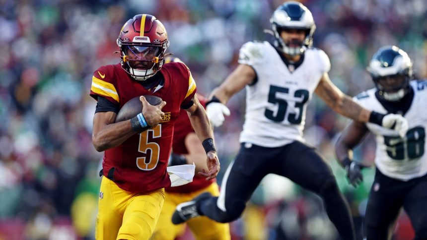 Dec 22, 2024; Landover, Maryland, USA; Washington Commanders quarterback Jayden Daniels (5) runs the ball against the Philadelphia Eagles during the third quarter at Northwest Stadium. Mandatory Credit: Peter Casey-Imagn Images