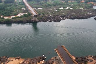 A drone view shows a collapsed bridge between Aguiarnopolis and Estreito, Brazil on December 24, 2024.