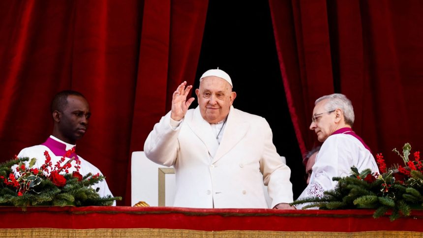 Pope Francis waves on the day he delivers his traditional Christmas Day Urbi et Orbi speech to the city and the world from the main balcony of St. Peter's Basilica at the Vatican, December 25, 2024. REUTERS/Yara Nardi