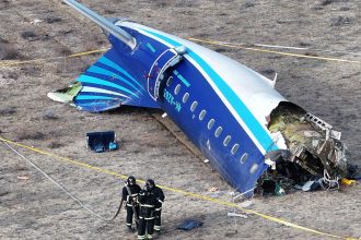 A drone view shows emergency specialists working at the crash site of an Azerbaijan Airlines passenger plane near the city of Aktau, Kazakhstan December 25, 2024. REUTERS/Azamat Sarsenbayev