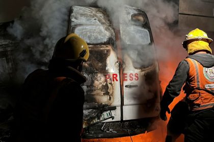 Civil Defense members put out a fire in a broadcast van following an Israeli strike that killed five journalists, according to medics with the Gaza health authorities.