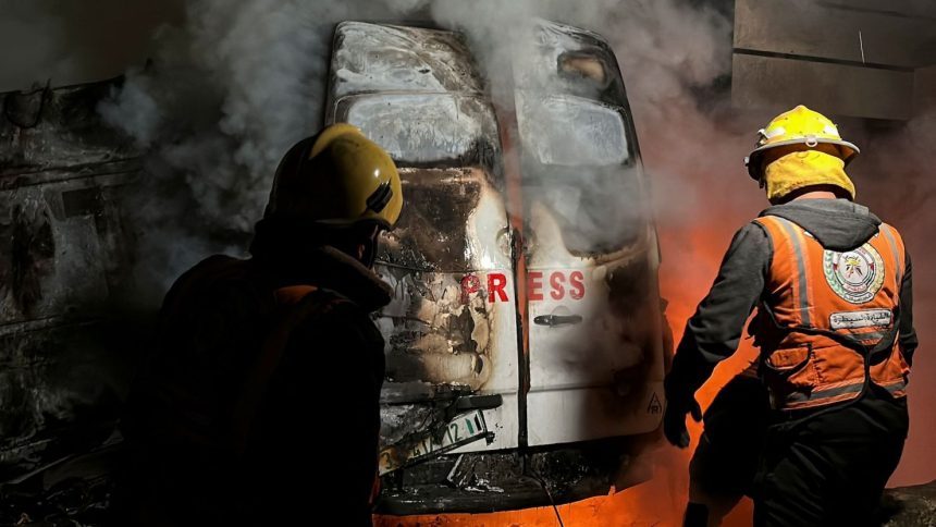 Civil Defense members put out a fire in a broadcast van following an Israeli strike that killed five journalists, according to medics with the Gaza health authorities.