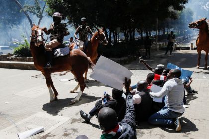 Riot police lob tear gas canisters as they attempt to disperse protesters, demonstrating against what they say is a wave of unexplained abductions of government critics, in downtown Nairobi, Kenya, on Monday.