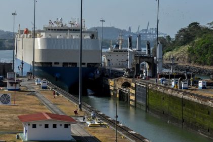 A ship is guided through the Panama Canal's Miraflores locks near Panama City on April 24, 2023. - The scarcity of rainfall due to global warming has forced the Panama Canal to reduce the draft of ships passing through the interoceanic waterway, in the midst of a water supply crisis that threatens the future of this maritime route. The Alhajuela lake, in the Colon province, 50 km north of Panama City, is one of the main lakes that supplies water to the locks of the Panama Canal and is at its lowest level of recent years. (Photo by Luis ACOSTA / AFP) (Photo by LUIS ACOSTA/AFP via Getty Images)