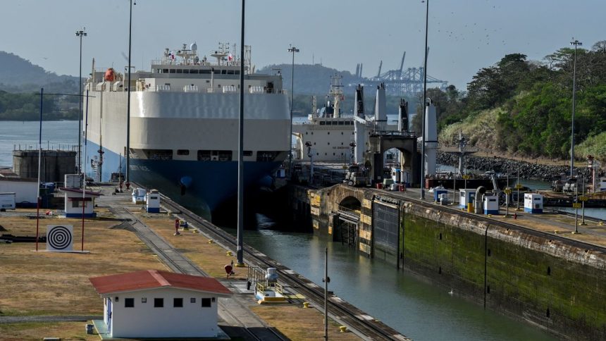 A ship is guided through the Panama Canal's Miraflores locks near Panama City on April 24, 2023. - The scarcity of rainfall due to global warming has forced the Panama Canal to reduce the draft of ships passing through the interoceanic waterway, in the midst of a water supply crisis that threatens the future of this maritime route. The Alhajuela lake, in the Colon province, 50 km north of Panama City, is one of the main lakes that supplies water to the locks of the Panama Canal and is at its lowest level of recent years. (Photo by Luis ACOSTA / AFP) (Photo by LUIS ACOSTA/AFP via Getty Images)