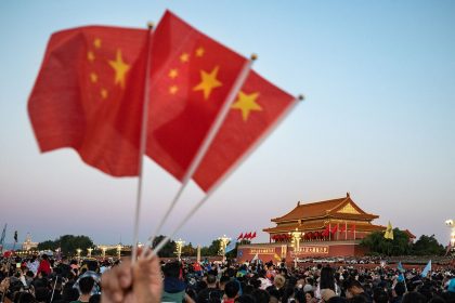 Visitors gather for the flag raising ceremony at Tiananmen Square to mark National Day in Beijing, China on Sunday, October 1, 2023.