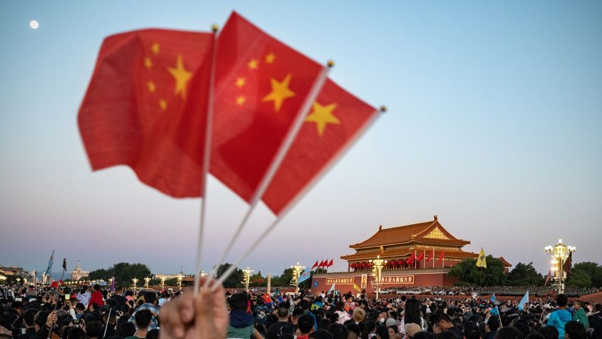 Visitors gather for the flag raising ceremony at Tiananmen Square to mark National Day in Beijing, China on Sunday, October 1, 2023.