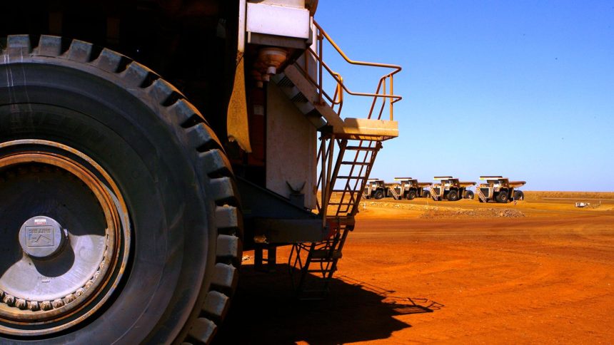 Large dump trucks lined up at Rio Tinto operations at Dampier in Western Australia in 2010.