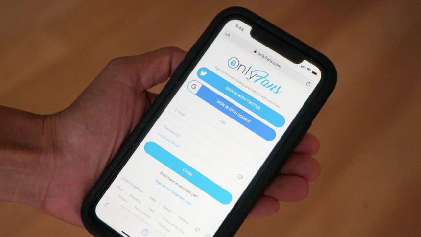 The OnlyFans website is seen on a cell phone in New York on April 16, 2021.