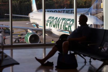 A Frontier Airlines plane sits on the tarmac at Cancun International Airport in Mexico.