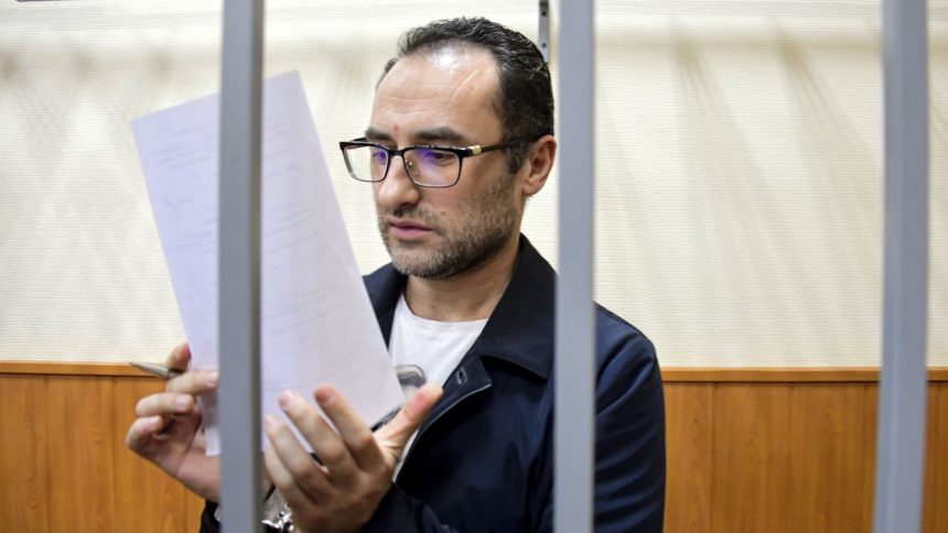 Eugene Spector behind bars in a Moscow courtroom in February 2020.