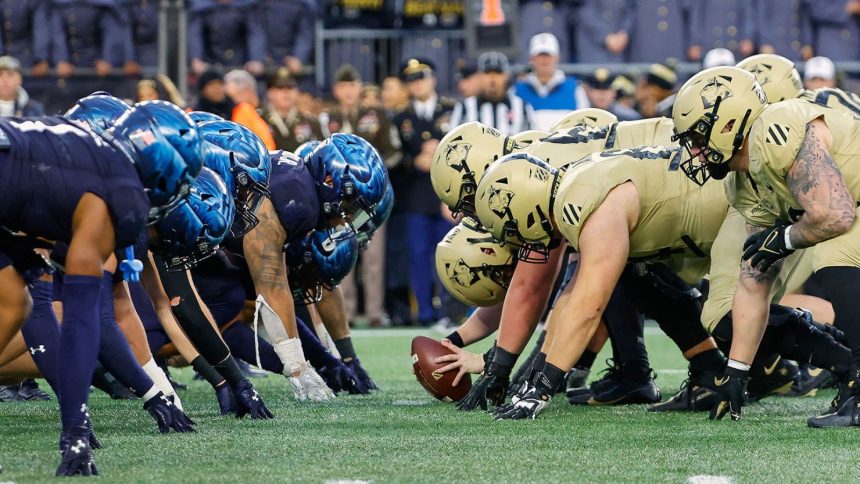 The Black Knights and the Midshipmen prepare for battle at the line of scrimmage during the 2023 edition of the Army-Navy game.