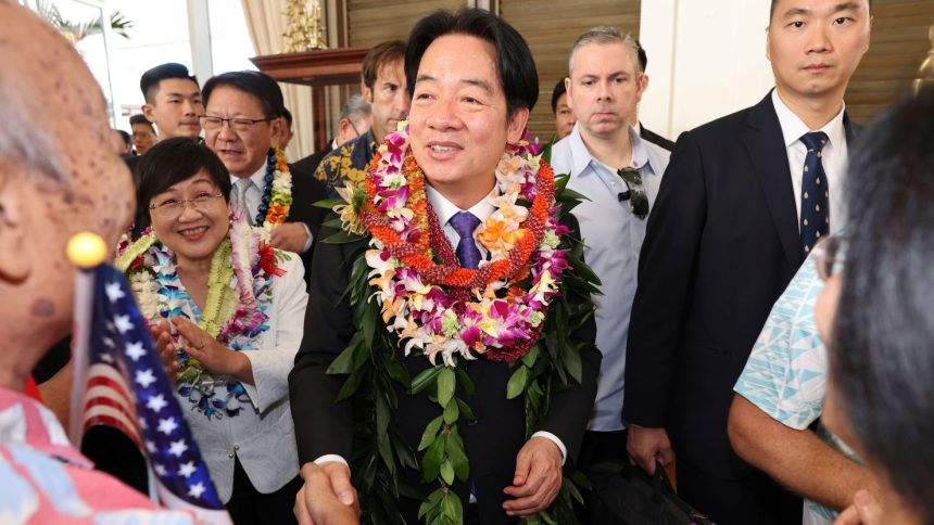 Taiwan President Lai Ching-te, center, greets people at the Kahala Hotel and Resort Saturday, Nov. 30, 2024 in Honolulu. (AP Photo/Marco Garcia)