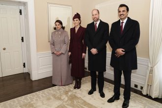 Britain's Prince William, center right, and Kate, Princess of Wales, center left, pose with the Emir of Qatar Sheikh Tamim bin Hamad Al Thani, right, and his wife Sheikha Jawaher, left, as they meet in London.