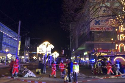 Emergency services and firefighters attend the scene at the Christmas market in Magdeburg on December 20.