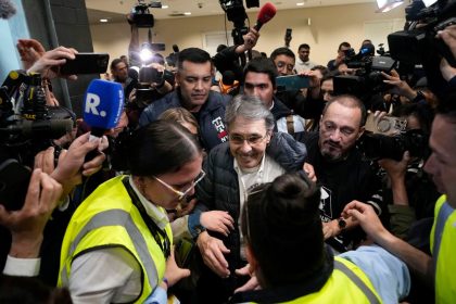 Media swarm Fabio Ochoa, center, a former member of the Medellin cartel, upon his arrival at El Dorado airport in Bogota, Colombia, December 23, 2024.