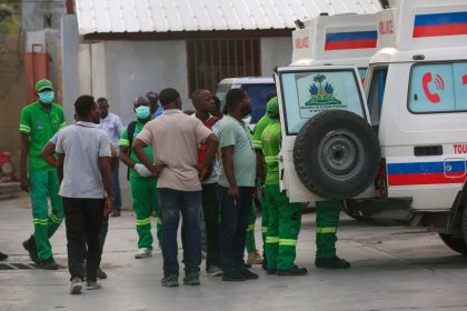 Medics inspect an ambulance of wounded people, shot by armed gangs at the General Hospital, in Port-au-Prince, Haiti, on Tuesday, December 24.