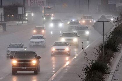 Vehicles make their way on a rain soaked highway in Dallas, Thursday, December 26, 2024.