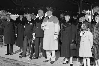 President Franklin Roosevelt, Prime Minister Winston Churchill and members of their party leave the White House in Washington on December 25, 1941, for Christmas services at the Foundry Methodist Church. From left to right are Lord Beaverbrook, British minister of supply; First lady Eleanor Roosevelt; the prime minister; the president; and Gen. E. M. Watson.