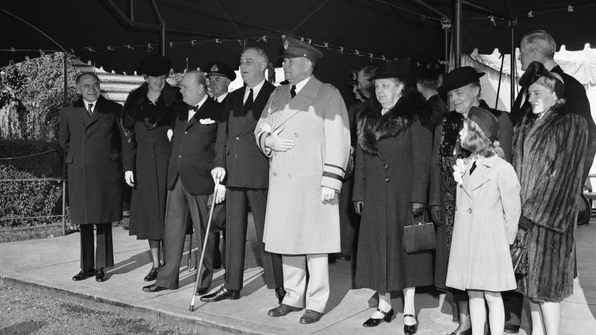 President Franklin Roosevelt, Prime Minister Winston Churchill and members of their party leave the White House in Washington on December 25, 1941, for Christmas services at the Foundry Methodist Church. From left to right are Lord Beaverbrook, British minister of supply; First lady Eleanor Roosevelt; the prime minister; the president; and Gen. E. M. Watson.