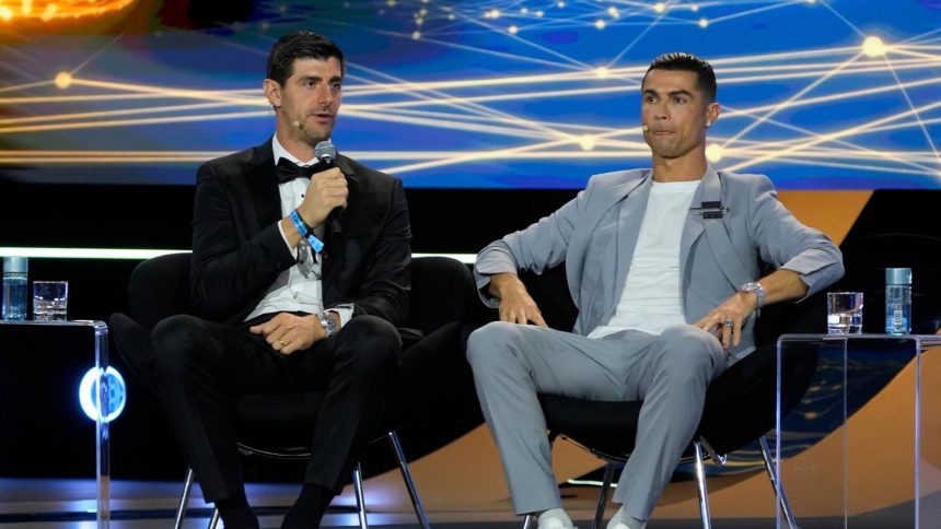 Cristiano Ronaldo and Thibaut Courtois take the podium at the 15th Edition of the Globe Soccer Awards in Dubai on December 27.