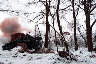 A Ukrainian soldier during combat work with M101 howitzer on December 6 in Kharkiv, Ukraine.