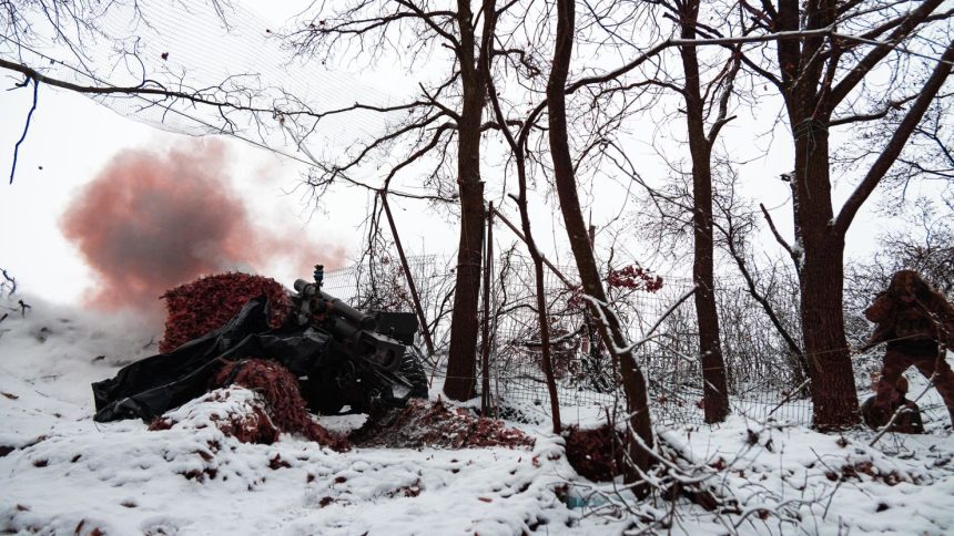 A Ukrainian soldier during combat work with M101 howitzer on December 6 in Kharkiv, Ukraine.