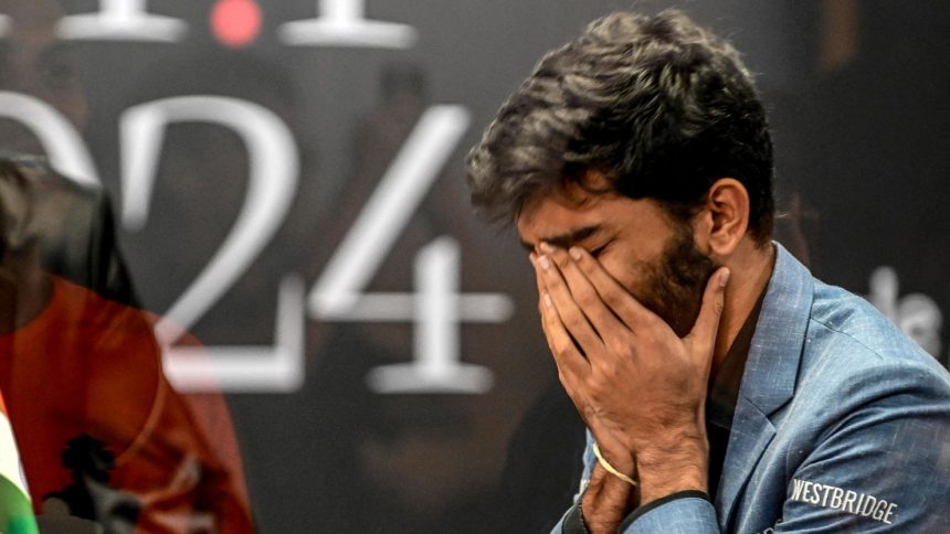 India's grandmaster Gukesh Dommaraju reacts after winning against China's chess grandmaster Ding Liren in game 14 of the 2024 FIDE World Championship in Singapore on December 12.