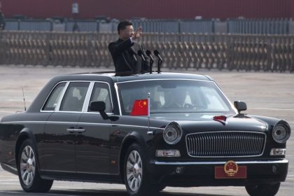 BEIJING, CHINA - OCTOBER 01: Chinese President Xi Jinping waves as he drives after inspecting the troops during a parade to celebrate the 70th Anniversary of the founding of the People's Republic of China at Tiananmen Square in 1949, on October 1, 2019 in Beijing, China. (Photo by Kevin Frayer/Getty Images)