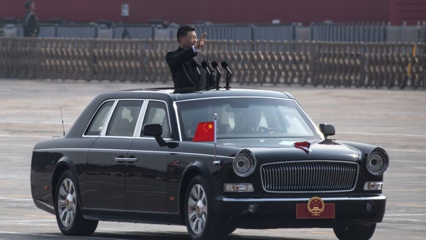 BEIJING, CHINA - OCTOBER 01: Chinese President Xi Jinping waves as he drives after inspecting the troops during a parade to celebrate the 70th Anniversary of the founding of the People's Republic of China at Tiananmen Square in 1949, on October 1, 2019 in Beijing, China. (Photo by Kevin Frayer/Getty Images)