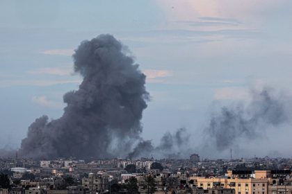 This picture taken from Rafah shows smoke billowing over Khan Younis in the distance following Israeli bombardment on the southern Gaza Strip on February 14, 2024.