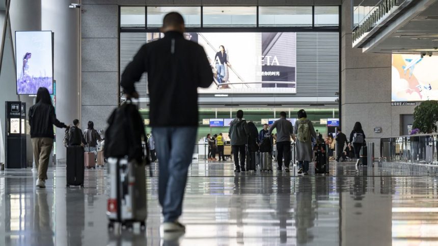 Travelers at Hongqiao International Airport in Shanghai, China. Shanghai is mainland China's biggest city as well as the most visited by tourists.