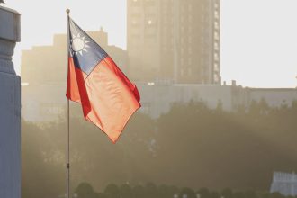 A Taiwanese flag flies at the Chiang Kai-shek Memorial Hall in Taipei on October 15, 2024.