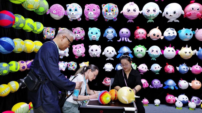 People visit a booth of toys during the third phase of the 136th China Import and Export Fair at the Canton Fair Complex on October 31, 2024 in Guangzhou, Guangdong Province of China.