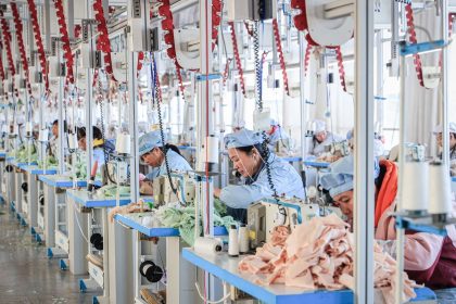 Employees work on a production line making stuffed teddy bears for export at a factory in Lianyungang, in eastern China's Jiangsu province on November 22, 2024.