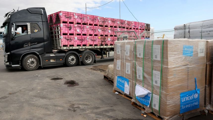 A picture taken during a tour organised by the Israeli Army shows an Israeli truck transporting aid destined for the Gaza Strip at a drop-off area near the Kerem Shalom crossing, on November 28, 2024.