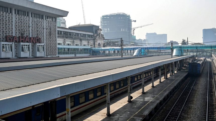 Passenger trains are parked at Hanoi Railway Station in Hanoi on November 30, 2024. Vietnam will build a $67 billion high-speed railway from Hanoi to Ho Chi Minh City, after the country's rubber-stamp parliament gave the go-ahead to the long-awaited project on November 30. (Photo by Nhac NGUYEN / AFP) (Photo by NHAC NGUYEN/AFP via Getty Images)