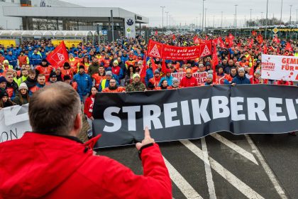 Employees of German car maker Volkswagen (VW) demonstrate in front of the VW plant in Zwickau, eastern Germany, on December 2, 2024, as thousands of Volkswagen workers go on strike all over Germany in an escalating industrial dispute at the crisis-hit German auto giant with thousands of jobs at stake. VW has been hit hard by high manufacturing costs at home, a stuttering shift to electric vehicles and tough competition in key market China. It has announced a plan to cut billions of dollars in costs.