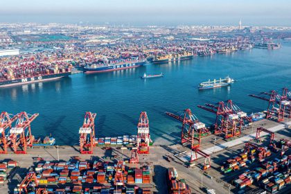 Shipping containers and gantry cranes at Qingdao port in eastern China's Shandong province, seen on December 4, 2024.